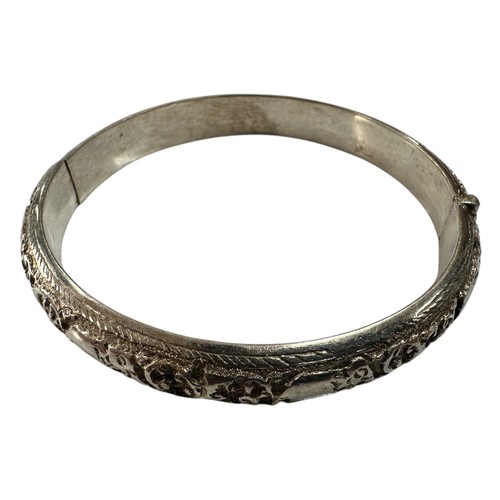 37 - Colonial Silver Hinged Bangle with Chased Elephant and Scrollwork Design - stamped 'SS'