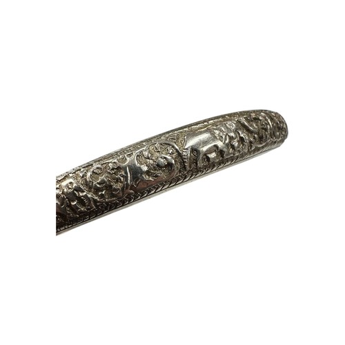 37 - Colonial Silver Hinged Bangle with Chased Elephant and Scrollwork Design - stamped 'SS'