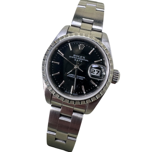 334 - Rolex Oyster Perpetual Date Ladies Stainless Steel Watch. Black Face, Serial Number F704596. All Ori... 