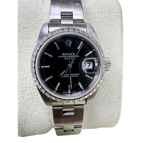 334 - Rolex Oyster Perpetual Date Ladies Stainless Steel Watch. Black Face, Serial Number F704596. All Ori... 