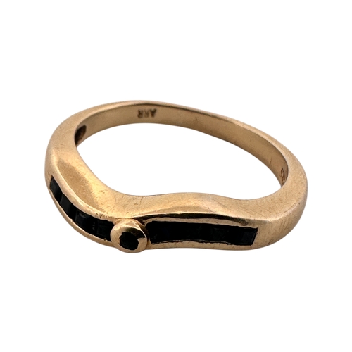 95 - Fourteen Carat Gold Ring set with Black Stones. Size S. 4.08g