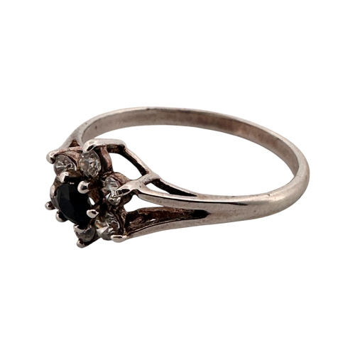 102 - Silver Ring set with Small White Stones & One Black. Size P