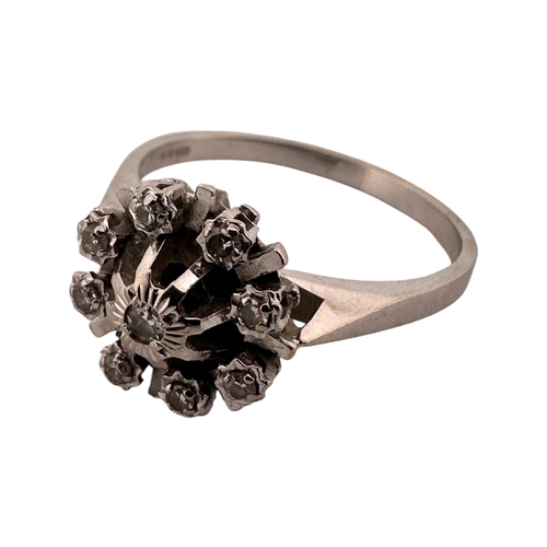 104 - Eighteen Carat White Gold Ring set with Nine Small Diamonds. Size P. 4.1g