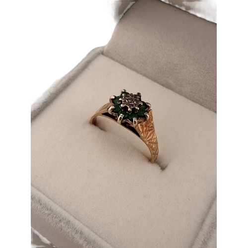 114 - Nine Carat Gold Ring set with Small Emeralds & a Small Diamond. Size L. 2.4g