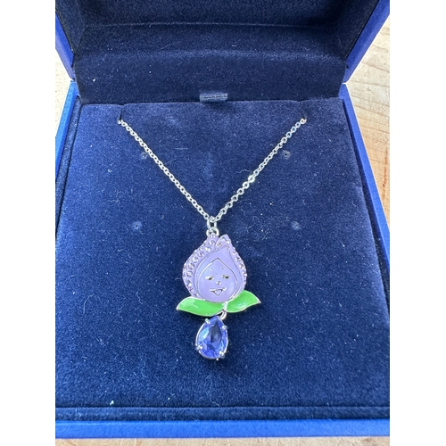 203 - Three Items of Disney Swarovski Pendants alondside Two Other Swarovski Pendants