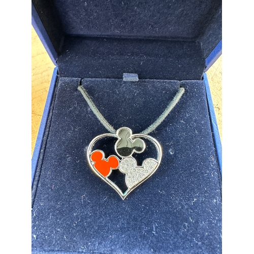 203 - Three Items of Disney Swarovski Pendants alondside Two Other Swarovski Pendants