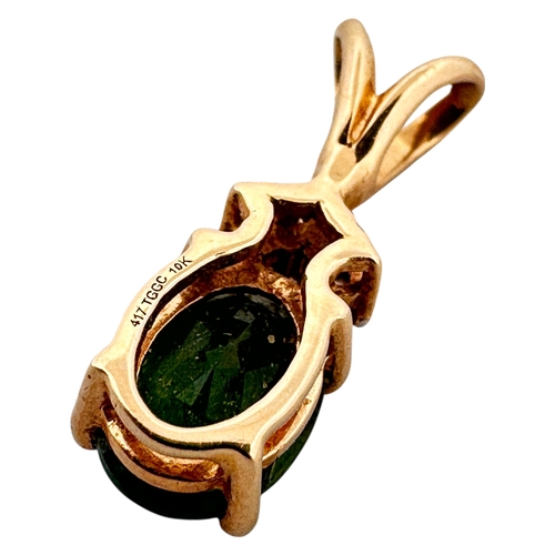 61 - Ten Carat Gold Pendant with Emerald Green Coloured Stone by TGGC. 1.02g