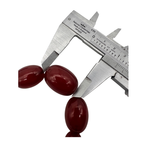 3 - Graduated Cherry Amber Bakelite Beads. 42.9g.  20.5