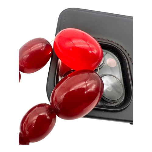 3 - Graduated Cherry Amber Bakelite Beads. 42.9g.  20.5