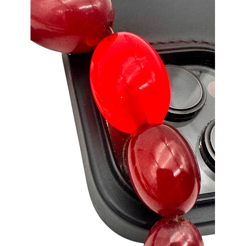3 - Graduated Cherry Amber Bakelite Beads. 42.9g.  20.5