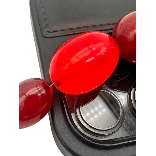 3 - Graduated Cherry Amber Bakelite Beads. 42.9g.  20.5