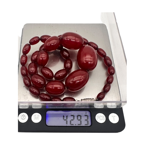 3 - Graduated Cherry Amber Bakelite Beads. 42.9g.  20.5