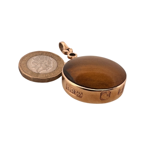 14 - Large Polished Stone Fob with Thick Hallmarked Gold Surround. 21.8g gross.