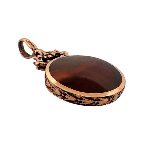 15 - Polished Stone Fob with Hallmarked Nine Carat Gold Surround. 9.32g gross