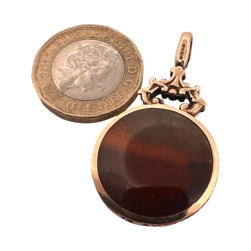 15 - Polished Stone Fob with Hallmarked Nine Carat Gold Surround. 9.32g gross