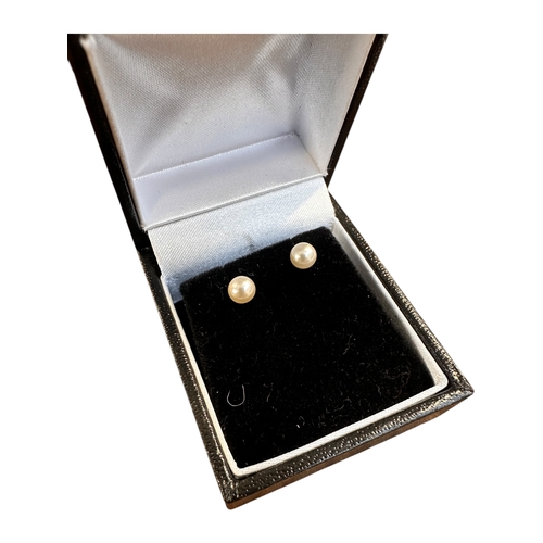 29 - Gold Mounted Pearl Stud earrings. Stamped 9k to Butterflies. Boxed.
