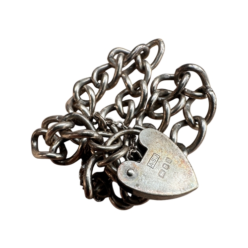 35 - Silver Bracelet with Heart Design Clasp. 14.49g...