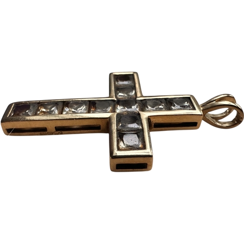 27 - Nine Carat Gold Cross Pendant Set with White Stones. 4.58g...