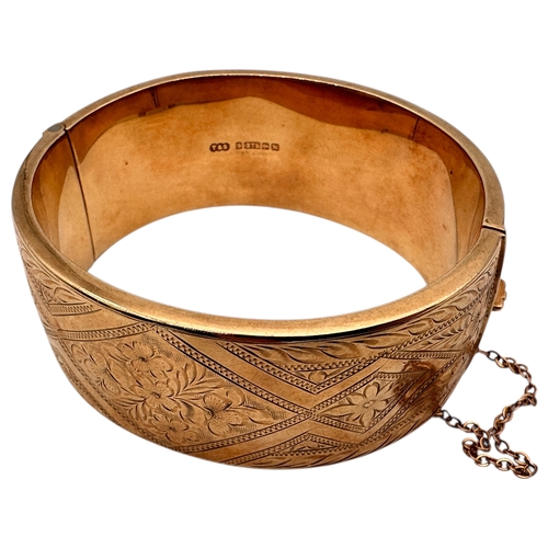 43 - Nine Carat Gold Engraved Hinged Bangle. 40.4g...