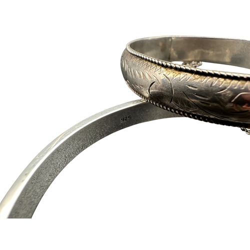 51 - One Modern Silver Bangle Marked 925 and One vintage Unmarked Bangle - 27 grams gross...