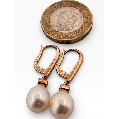 27 - Pair of Nine Carat Gold and Pearl Drop earrings. 4.08g gross...