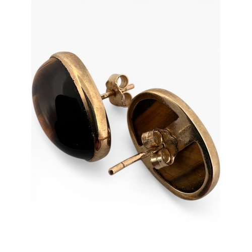 47 - Nine Carat Gold and Tigers Eye Earrings. 5.88g...