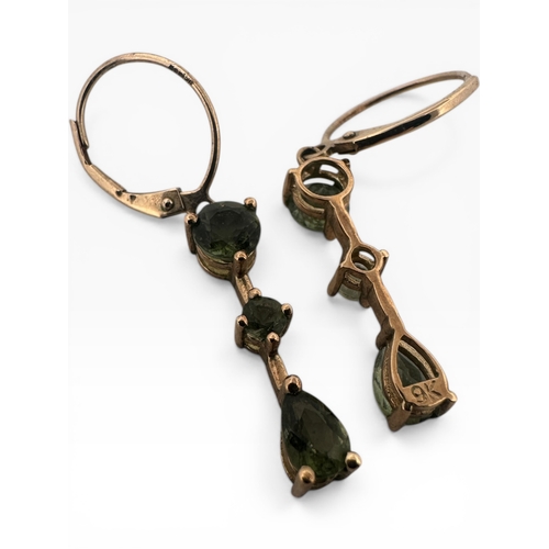 59 - Pair of Nine Carat Gold and Peridot Stone Earrings. 2.43g...