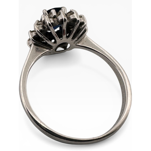 26 - Sapphire and Diamond Cluster Ring set in White Metal. Unmarked. Size O. 3.63g...