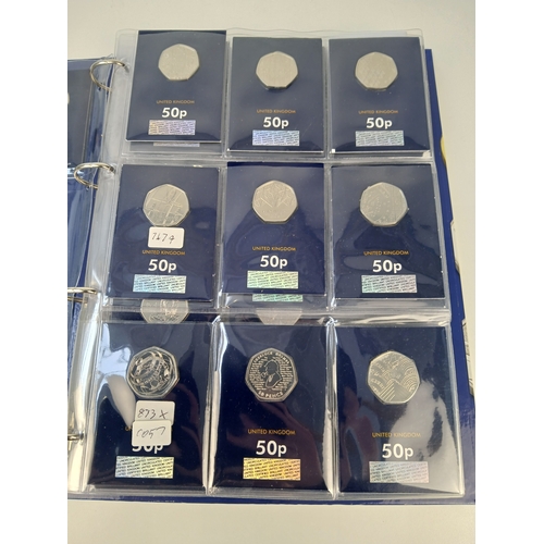 463 - Collection of Approximately 65 Commemorative 50p, £1 and £5 Coins in Change Checker Binder including... 