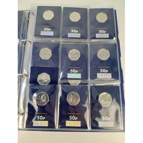 463 - Collection of Approximately 65 Commemorative 50p, £1 and £5 Coins in Change Checker Binder including... 