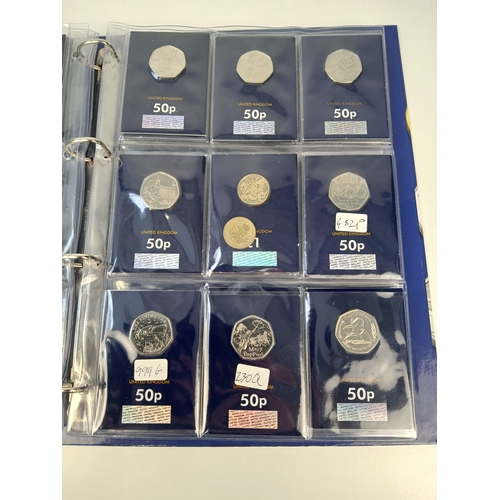463 - Collection of Approximately 65 Commemorative 50p, £1 and £5 Coins in Change Checker Binder including... 