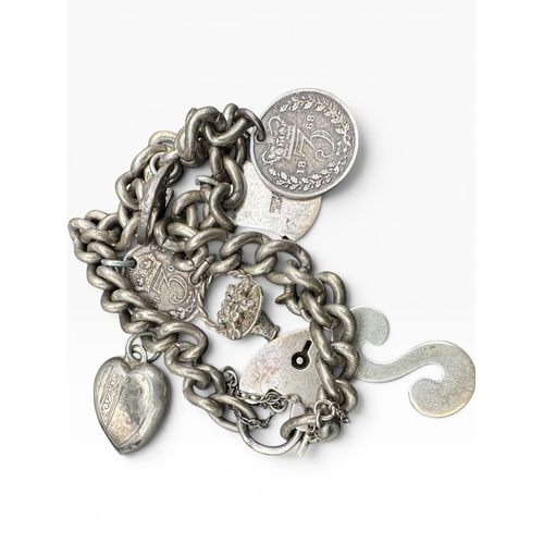 35 - Vintage Silver Charm Bracelet with Charms. 35.07g...