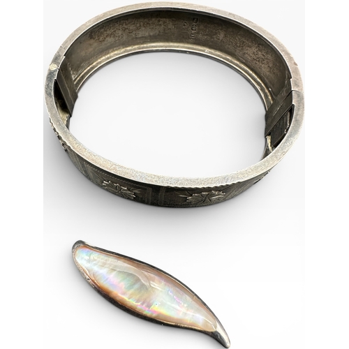 36 - Hallmarked Silver Hinged Bangle with 925 Silver and Mother of Pearl Pendant. 25g gross...