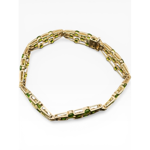 37 - Nine Carat Gold Bracelet set with Peridot Stones (one missing). 7
