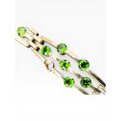 37 - Nine Carat Gold Bracelet set with Peridot Stones (one missing). 7