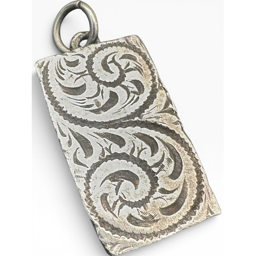9 - Silver Ingot Pendant with Engraved Detail. Sheffield 1977. 14.7g...