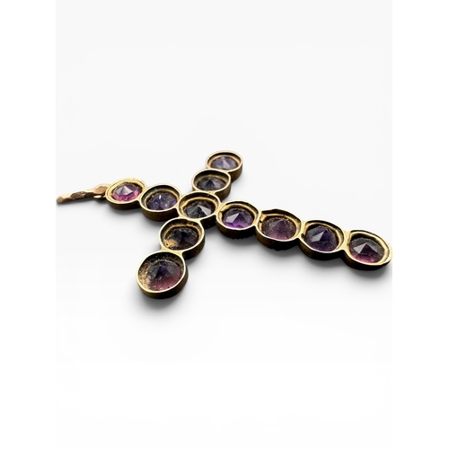 19 - Nine Carat Gold and Amethyst Cross Pendant. 2.37g...