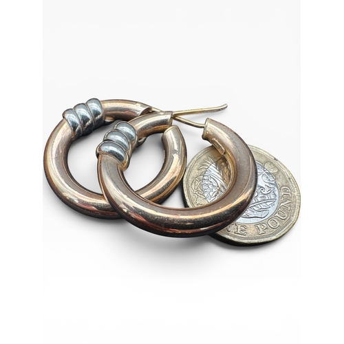 50 - Large Pair of Nine Carat Gold Hoop Earrings. 7.68g...