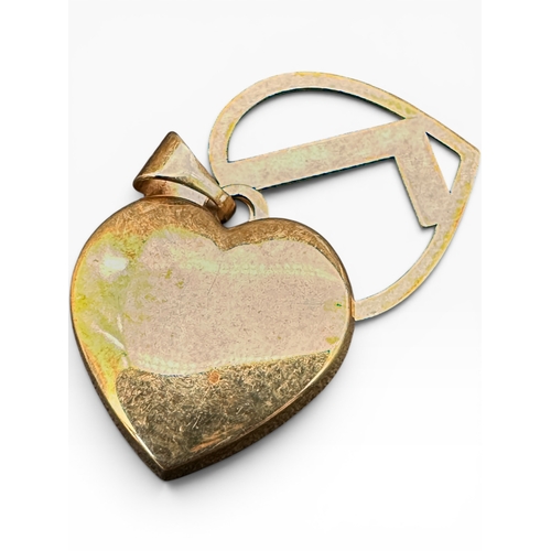 52 - Nine Carat Gold Heart and Initial 'L' Pendant. 1.27g