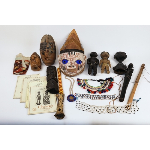 28 - A collection of African artefacts, 20th century, to include a group of figural statues, the tallest ... 