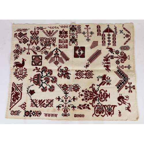 54 - An embroidered loom width Tatreez sampler, Ramallah, Palestine, c.1930, red and black silk on cream ... 