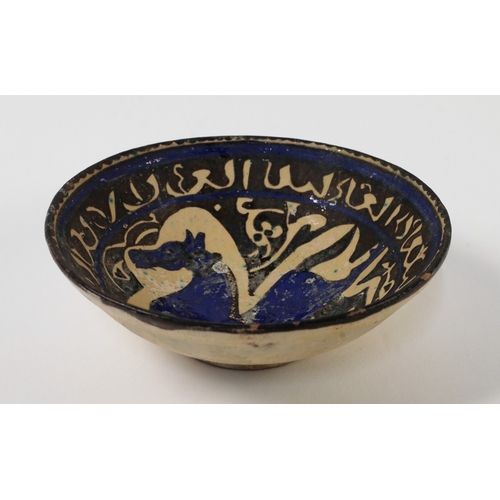 56 - A modern Ilkhanid revival figural pottery bowl, on short foot, the inside decorated with a prancing ... 