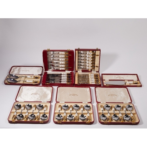 10 - A collection of Royal Crown Derby personalised cutlery, 20th century, designed with gilt and dark bl... 