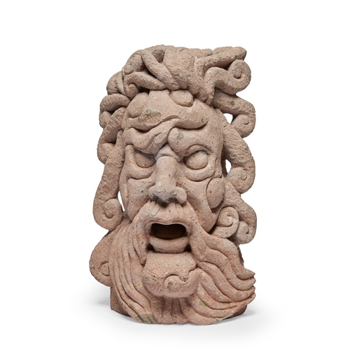 41 - A modern carved stone head of a god, modelled with flowing hair, 38cm highProvenance: Property of ... 