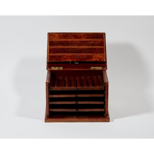 52 - An Edwardian yew wood and inlaid cigar box, the hinged folding lid opening to four trays, 15cm high,... 