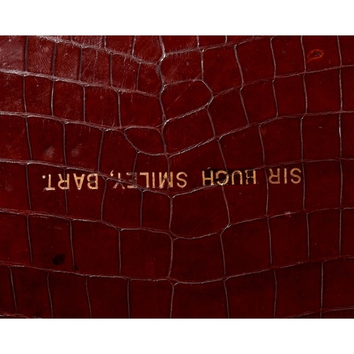 59 - Two brass-mounted brown crocodile leather travelling cases, early 20th century, the first by Leuchar... 