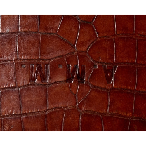 59 - Two brass-mounted brown crocodile leather travelling cases, early 20th century, the first by Leuchar... 