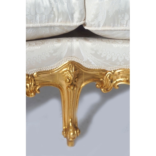 112 - ROCOCO CARVED AND PARCEL GILT SETTEE