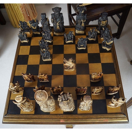 18 - CHESS TABLE AND 30 ANIMALIA AND FIGURAL PIECES