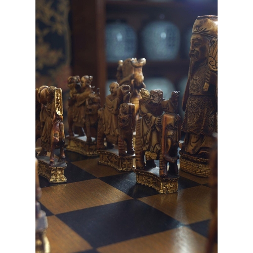 18 - CHESS TABLE AND 30 ANIMALIA AND FIGURAL PIECES